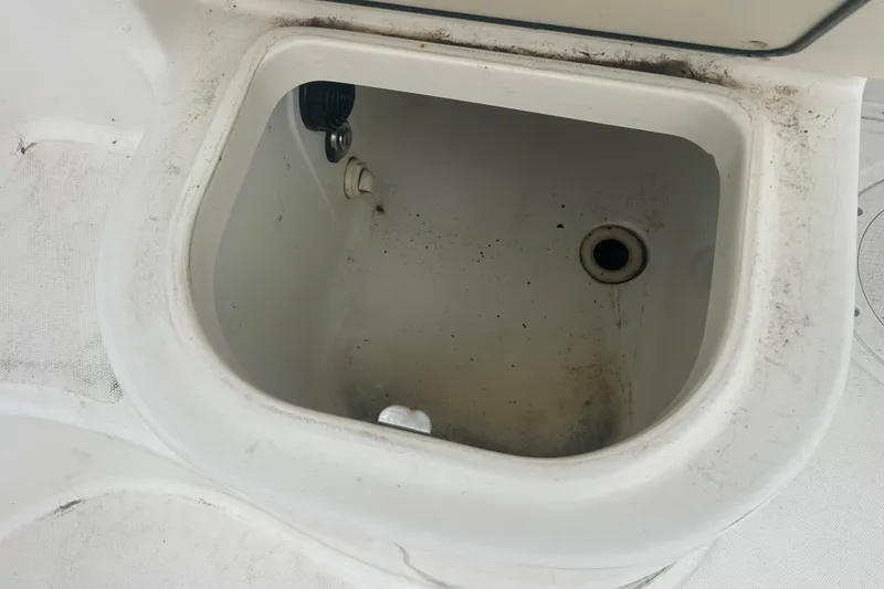 Slide: The Image of Open storage compartment on 2005 Boston Whaler 205 Eastport boat, showing interior details. - 8
