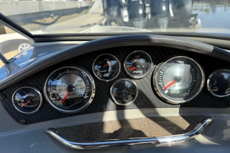 Slide: The Image of Dashboard of a 2018 Stingray 204 LR boat with gauges for speed, fuel, and RPM. - 17