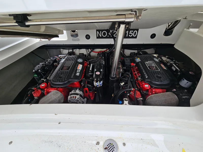 Slide: The Image of 2007 Cobalt 323 boat engine compartment with twin engines. - 10