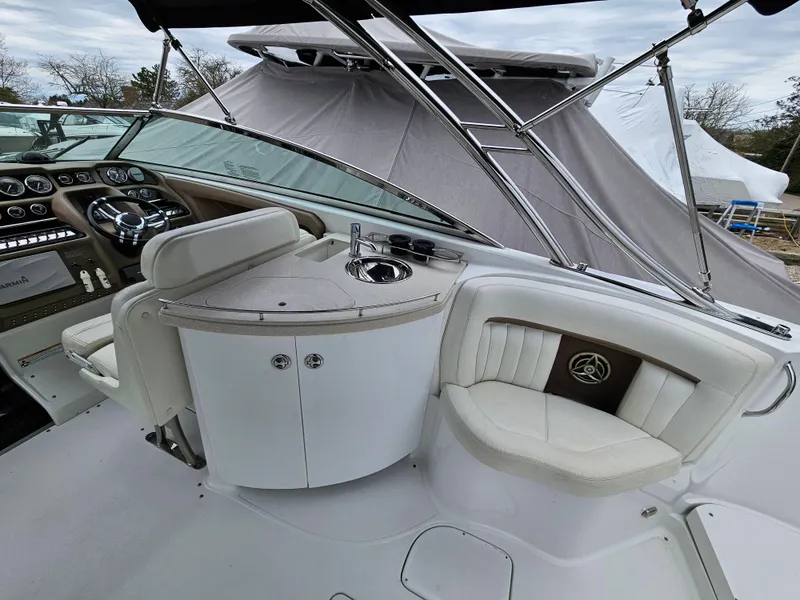 Slide: The Image of 2007 Cobalt 323 boat interior with helm, seating, and sink. - 5