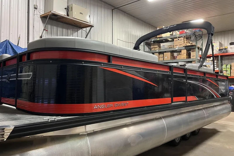 The Image of 2024 Angler Qwest 8522 LTZ Fish N Ski pontoon boat in a storage facility. - 0