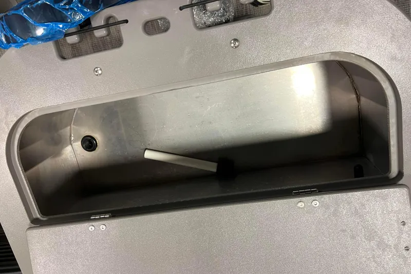 Slide: The Image of 2024 Angler Qwest 8522 LTZ Fish N Ski storage compartment, open and empty. - 10