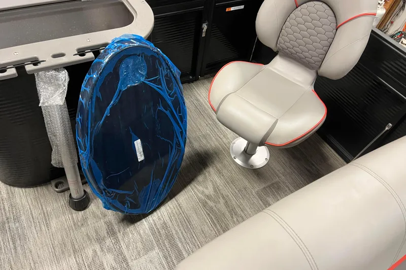 Slide: The Image of 2024 Angler Qwest 8522 LTZ Fish N Ski interior with seating and wrapped accessory. - 21