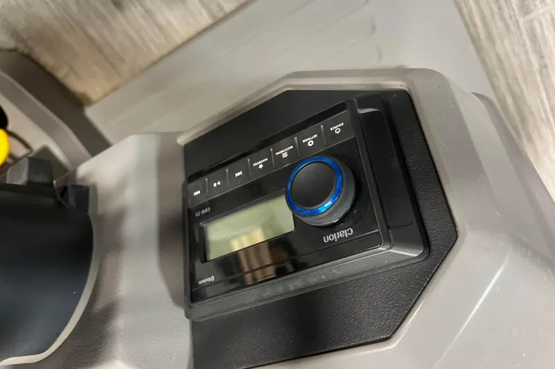 Slide: The Image of 2024 Angler Qwest 8522 LTZ FISH N SKI dashboard with Clarion audio system. - 23