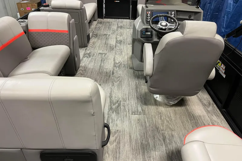 Slide: The Image of 2024 Angler Qwest 8522 LTZ Fish N Ski interior with modern seating and steering console. - 29