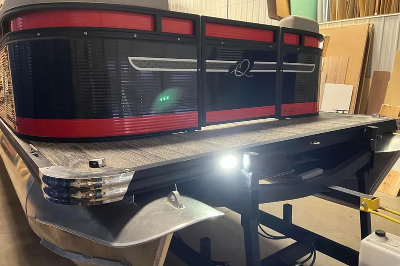 Slide: The Image of 2024 Angler Qwest 8522 LTZ Fish N Ski pontoon boat in a showroom setting. - 30