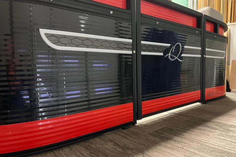 Slide: The Image of 2024 Angler Qwest 8522 LTZ FISH N SKI boat, sleek black and red design. - 31