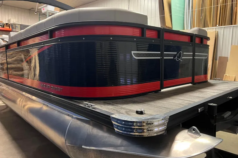 Slide: The Image of 2024 Angler Qwest 8522 LTZ Fish N Ski pontoon boat in a showroom setting. - 6