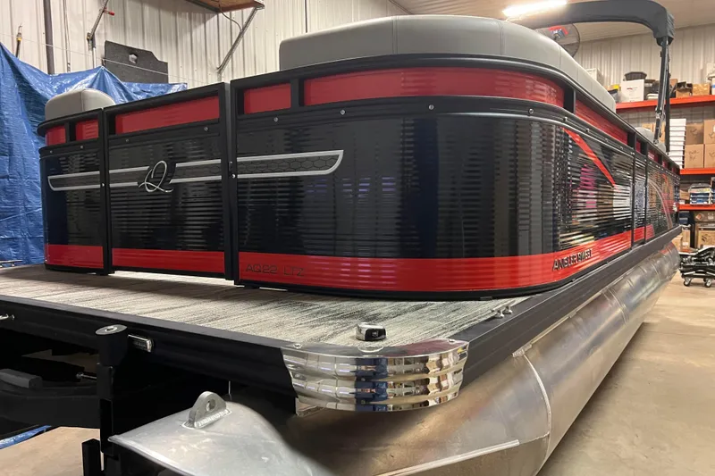 Slide: The Image of 2024 Angler Qwest 8522 LTZ Fish N Ski pontoon boat in a showroom. - 7