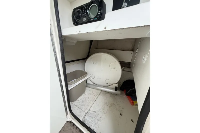 Slide: The Image of Interior of 2012 Sea Ray 240 Sundeck boat showing storage and equipment. - 40