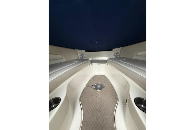Slide: The Image of Interior view of 2012 Sea Ray 240 Sundeck boat with cushioned seating. - 43