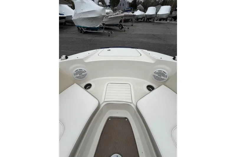 Slide: The Image of 2012 Sea Ray 240 Sundeck interior view, showcasing seating and speakers. - 53