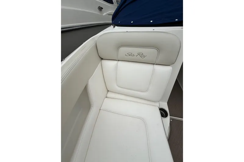 Slide: The Image of White leather seating on a 2012 Sea Ray 240 Sundeck boat. - 55