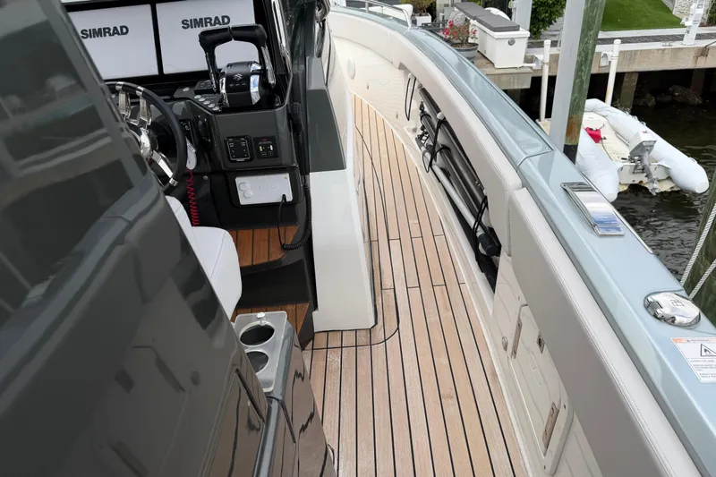Slide: The Image of 2023 Schaefer V33 yacht cockpit with Simrad electronics and teak flooring. - 19