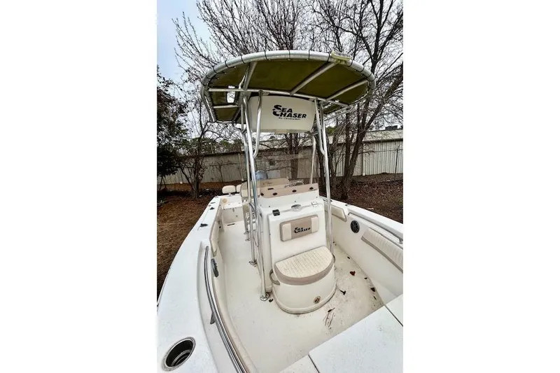 Slide: The Image of 2015 Sea Chaser 20 HFC boat with canopy, parked outdoors. - 4