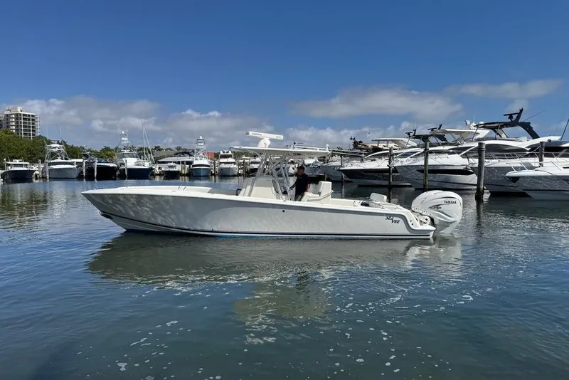 The Image of 2014 SeaVee 340B Open boat in marina, clear sky, calm water. - 0