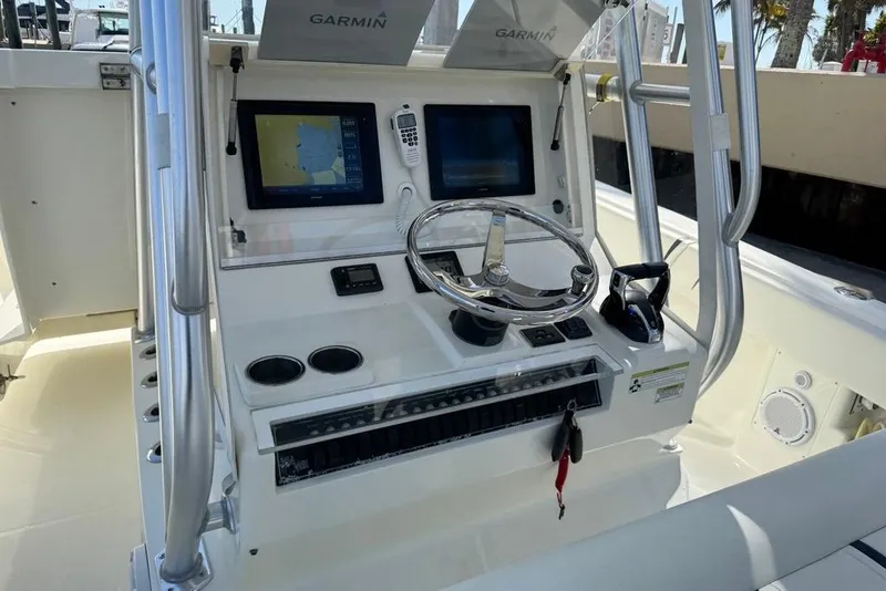 Slide: The Image of 2014 SeaVee 340B Open boat console with Garmin navigation displays and steering wheel. - 12