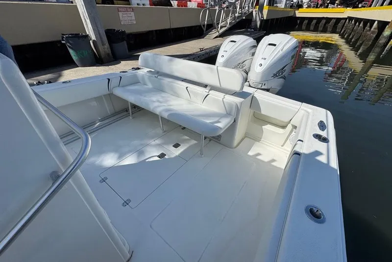 Slide: The Image of 2014 SeaVee 340B Open boat with dual engines, docked at a marina. - 7