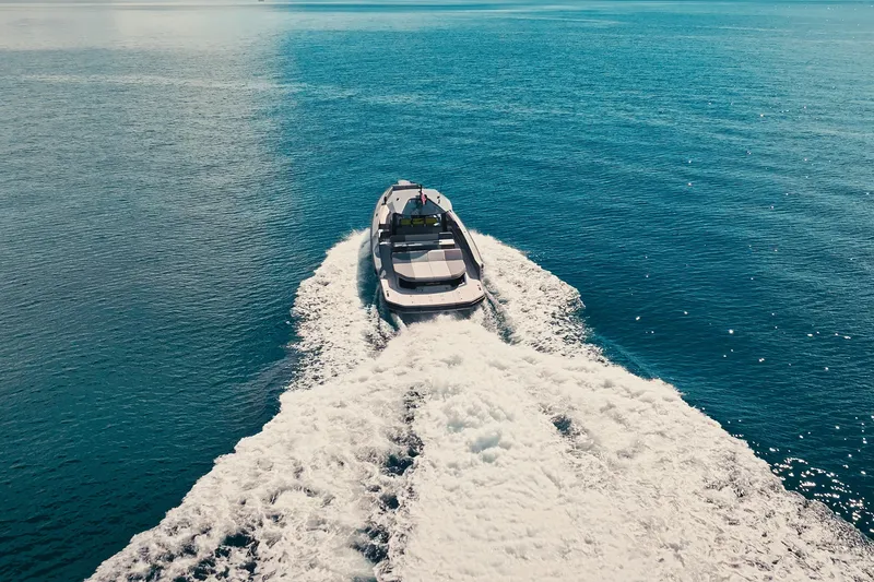 Slide: The Image of 2024 Maori 46ft yacht cruising on open blue sea, leaving a white wake. - 10