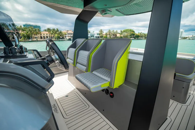 Slide: The Image of Luxurious 2024 Maori 46ft yacht interior with modern seating and scenic waterfront view. - 17