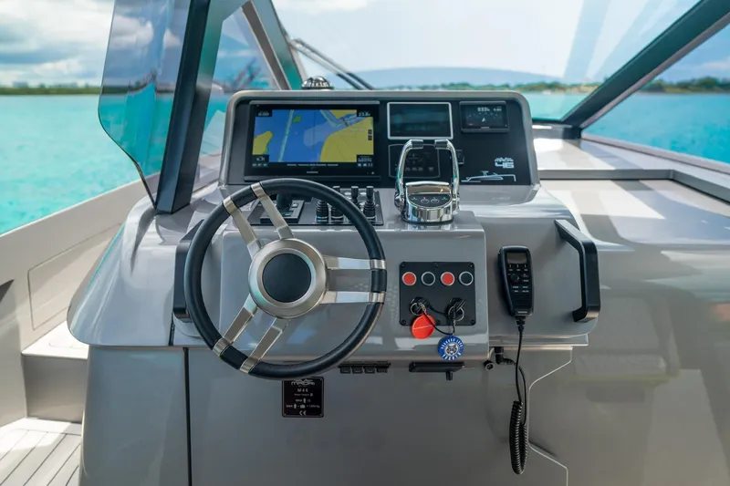 Slide: The Image of 2024 Maori 46ft yacht helm with navigation system and steering wheel. - 18