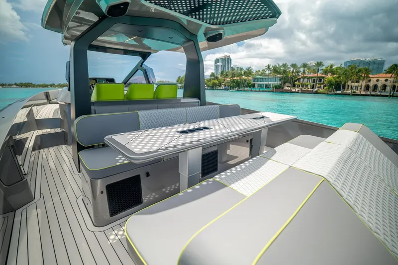 Slide: The Image of Luxurious 2024 Maori 46ft yacht with modern seating, cruising on turquoise waters. - 22