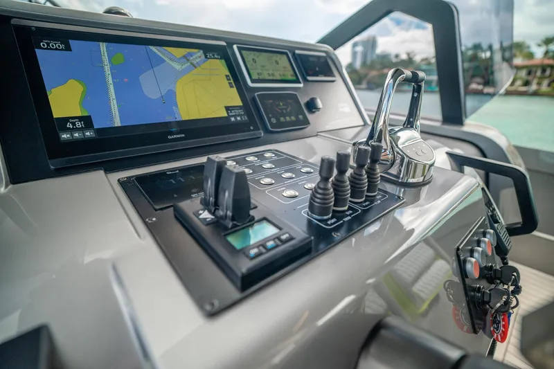 Slide: The Image of Control panel of 2024 Maori 46ft yacht with navigation screens and controls. - 25
