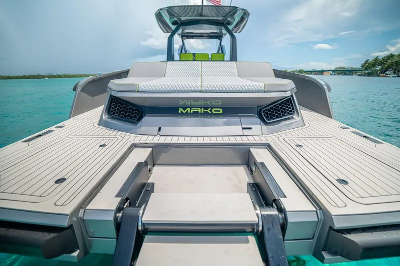 Slide: The Image of 2024 Maori 46ft boat with sleek deck design on turquoise water. - 29