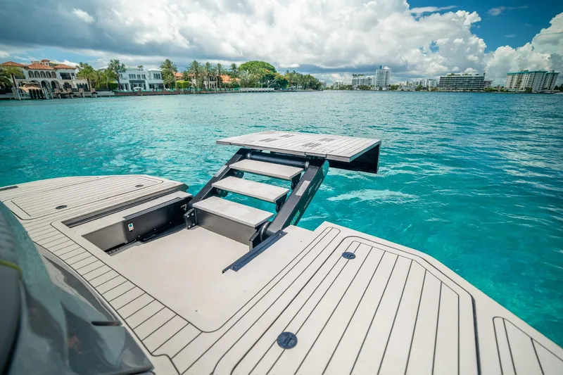 Slide: The Image of Luxury Maori 46ft yacht with retractable swim platform, 2024 model, in turquoise waters. - 30