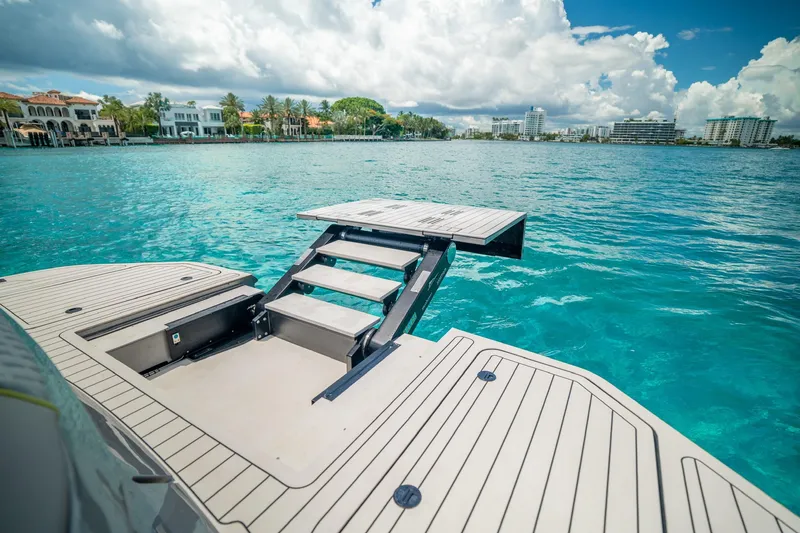 Slide: The Image of Luxury Maori 46ft yacht with extended swim platform, 2024 model, on turquoise water. - 31