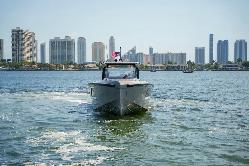 Slide: The Image of 2024 Maori 46ft yacht cruising near city skyline on a sunny day. - 38