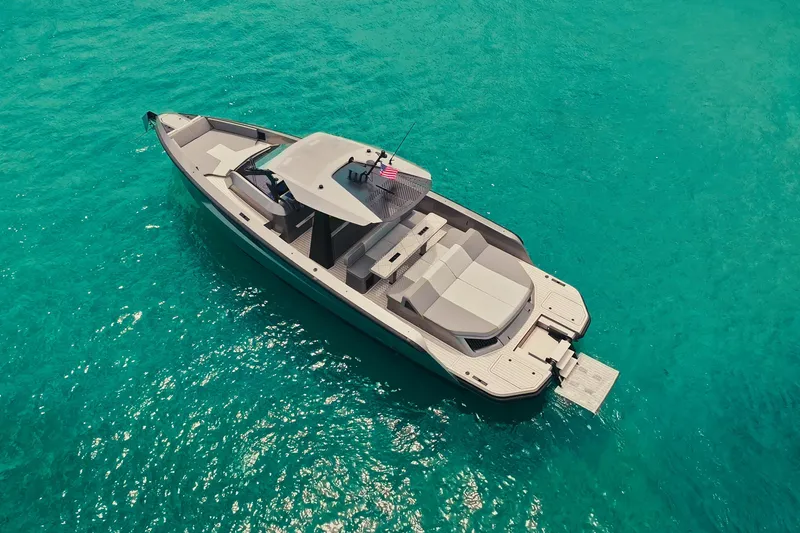Slide: The Image of 2024 Maori 46ft yacht on turquoise water, aerial view. - 7