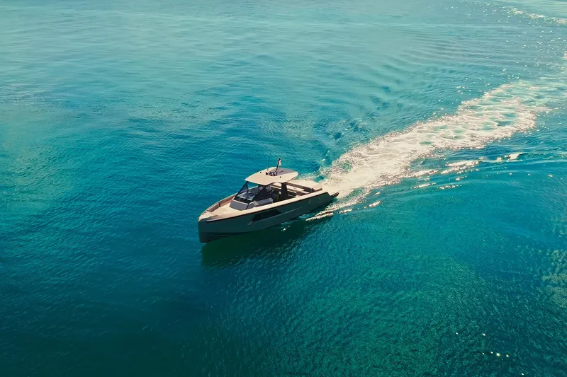 Slide: The Image of 2024 Maori 46ft yacht cruising on clear blue ocean waters. - 9