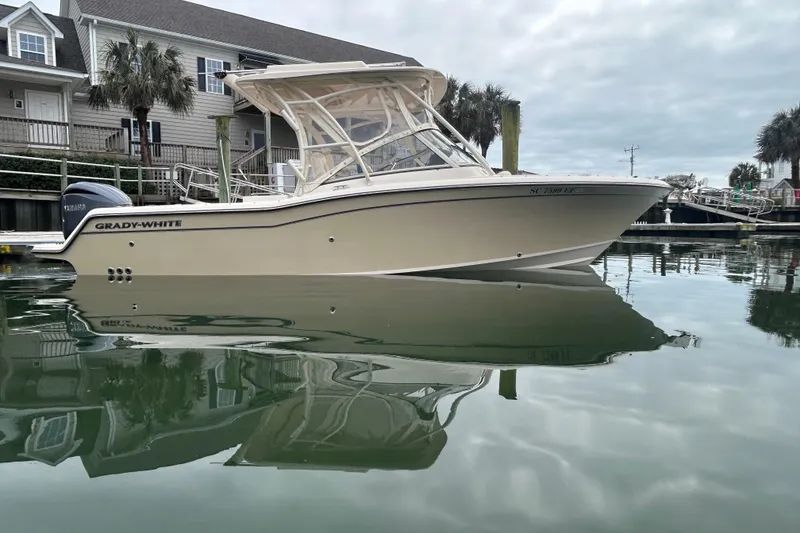 The Image of 2022 Grady-White Freedom 235 boat docked in calm marina waters. - 0