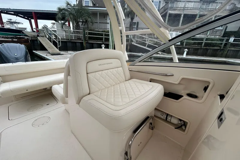 Slide: The Image of 2022 Grady-White Freedom 235 boat interior with luxurious seating and elegant design. - 10