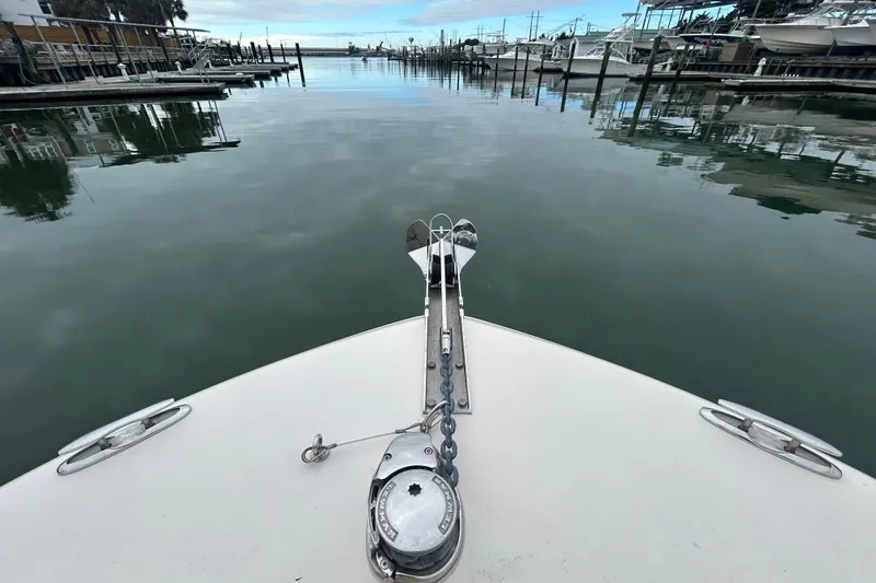 Slide: The Image of Bow view of 2022 Grady-White Freedom 235 boat in a calm marina. - 21