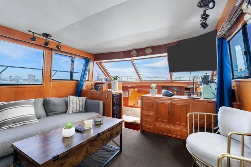 Slide: The Image of Luxurious 1988 Marine Trader Trawler interior with modern decor and panoramic windows. - 10