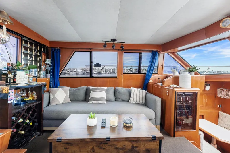 Slide: The Image of Luxurious 1988 Marine Trader Trawler interior with cozy seating and elegant decor. - 11