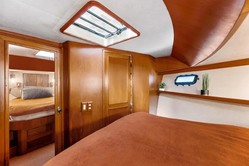 Slide: The Image of 1988 Marine Trader Trawler cabin interior with wood paneling and skylight. - 39