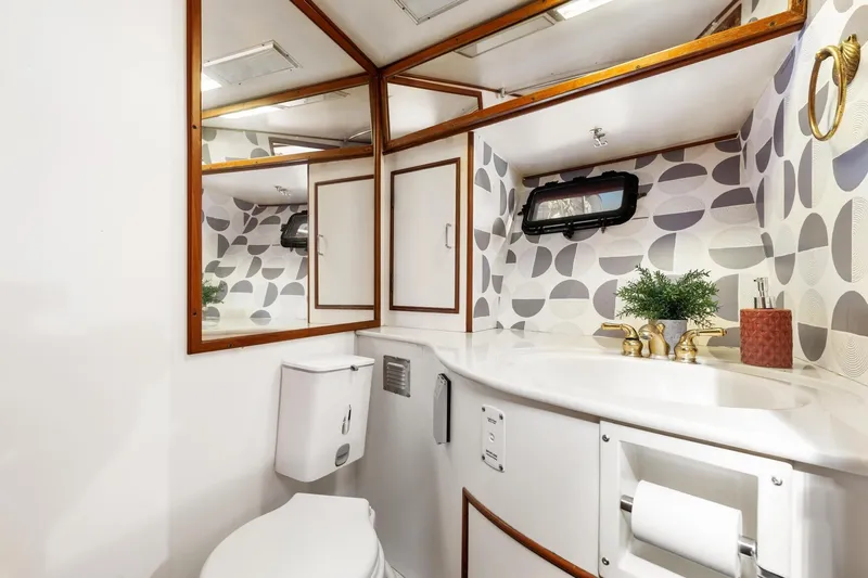 Slide: The Image of Elegant 1988 Marine Trader Trawler bathroom with modern fixtures and geometric wallpaper. - 41