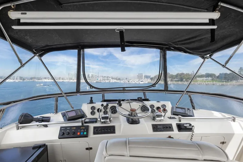 Slide: The Image of 1988 Marine Trader Trawler helm with panoramic ocean view and navigational controls. - 45