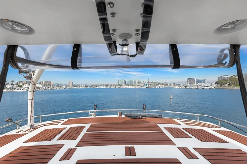 Slide: The Image of 1988 Marine Trader Trawler deck view overlooking marina and city skyline. - 57