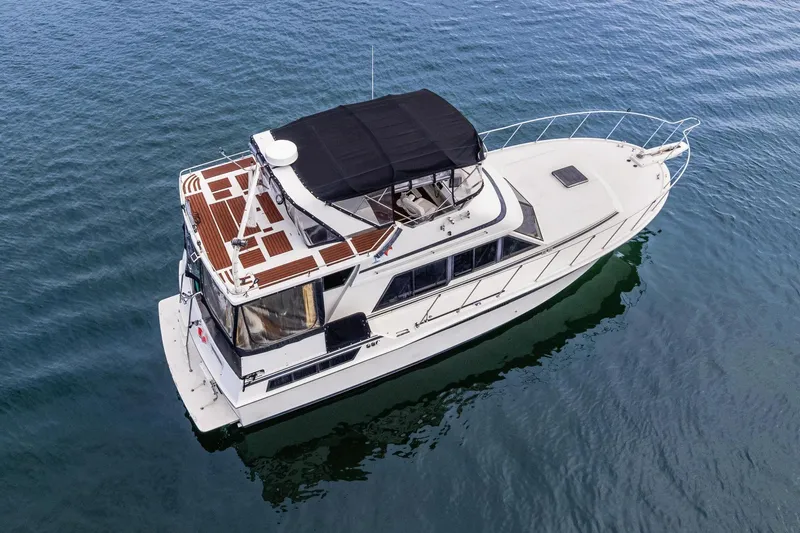 Slide: The Image of 1988 Marine Trader Trawler on calm water, aerial view. - 6