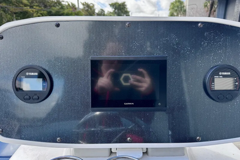 Slide: The Image of Dashboard of 2023 Novurania Catamaran 20 with Garmin and Yamaha displays. - 14