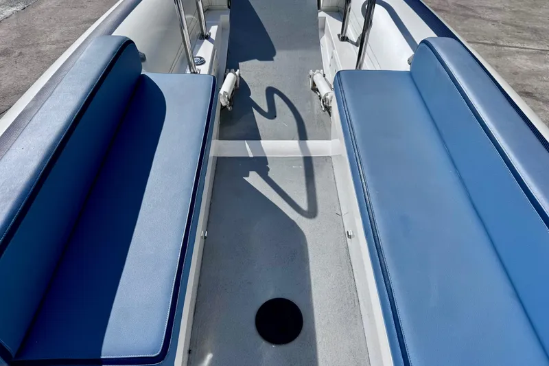 Slide: The Image of 2023 Novurania Catamaran 20 interior with blue seating and spacious layout. - 5