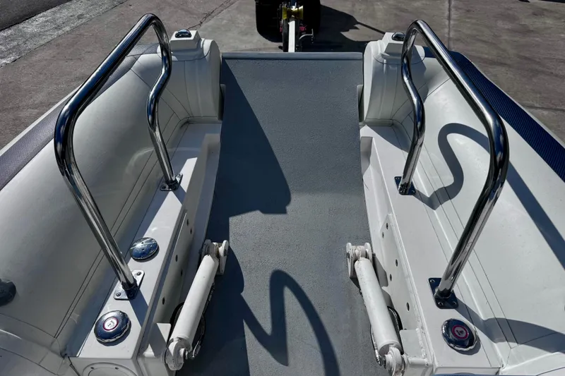 Slide: The Image of 2023 Novurania Catamaran 20 interior with stainless steel railings and seating. - 6