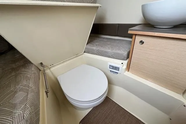 Slide: The Image of 2026 Chris-Craft Catalina 31 interior with compact bathroom and modern amenities. - 12