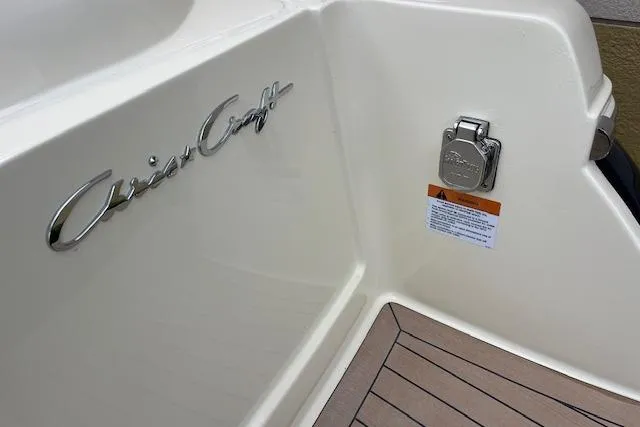 Slide: The Image of 2026 Chris-Craft Catalina 31 boat detail with logo and deck view. - 33