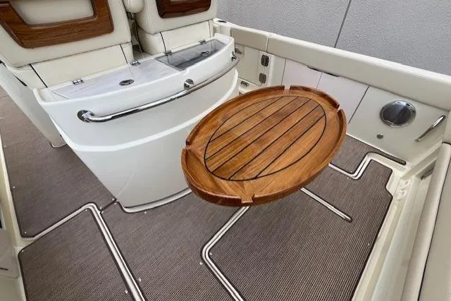 Slide: The Image of 2026 Chris-Craft Catalina 31 interior with elegant wooden table and seating. - 38