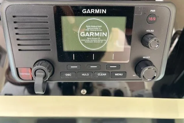Slide: The Image of Garmin marine radio on 2026 Chris-Craft Catalina 31 boat dashboard. - 44